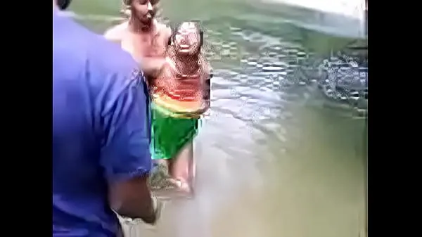 Show Indian people bathing in a river fresh Videos